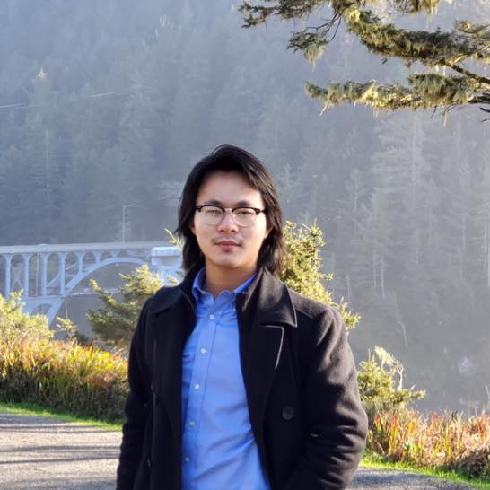 Alexandre Chern outdoors near a bridge